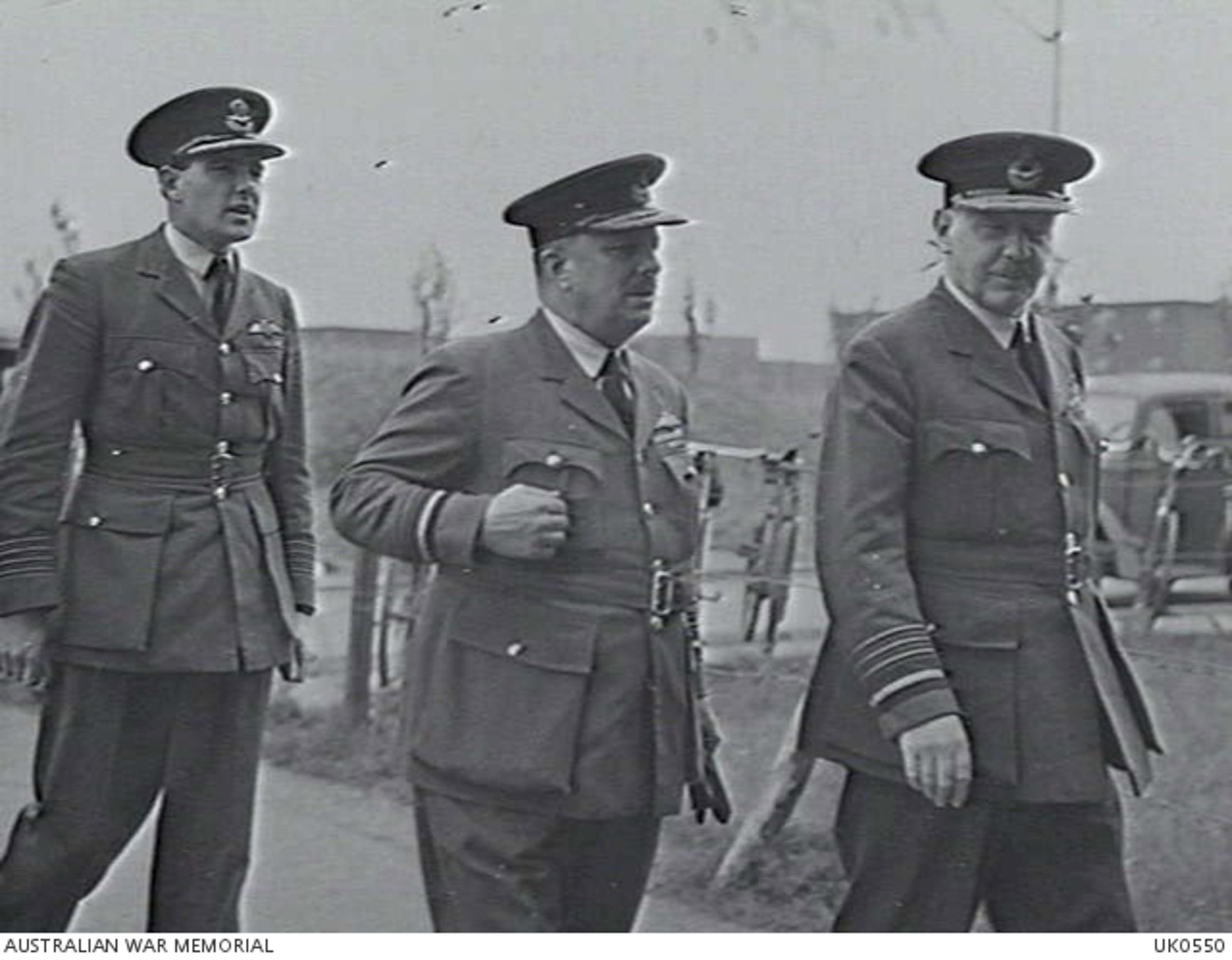 Right to left: Air Chief Marshall Sir Arthur Harris, Air Vice - Marshall E. A.B. Rice, Group Captain H. I. Edwards, VC